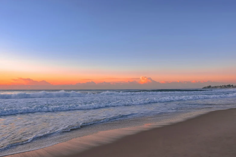 a view from the beach on an overcast evening