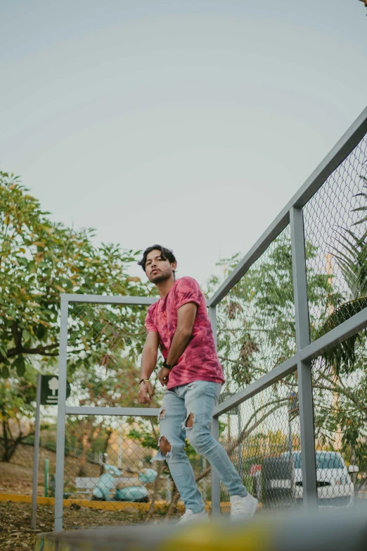 a man walking across a bridge in the woods