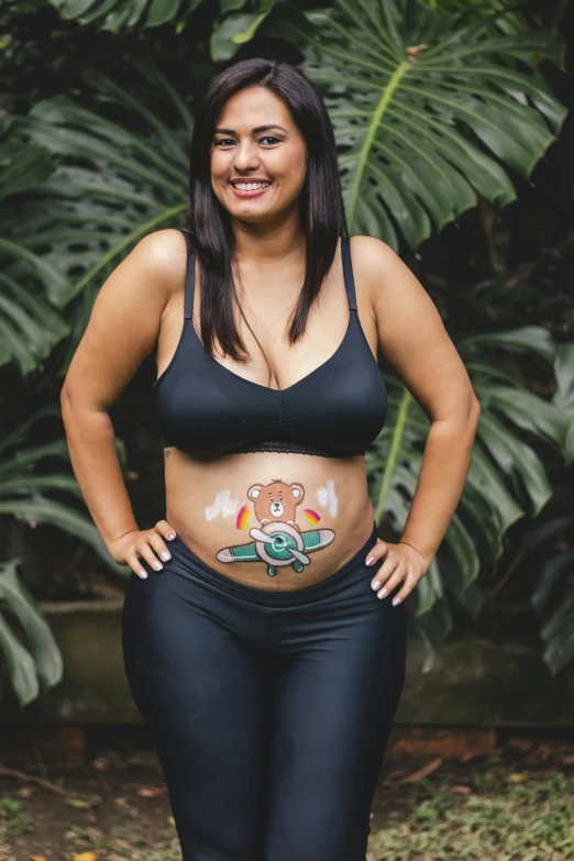 a woman in a bikini with bear on her belly