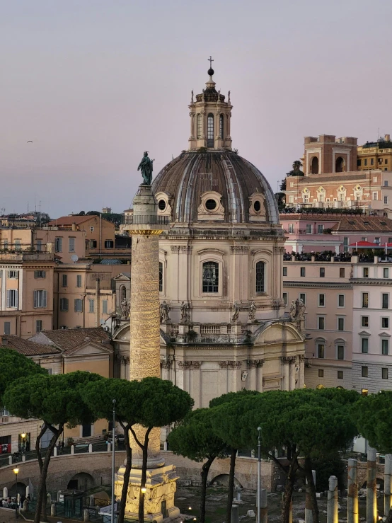 a city landscape featuring the dome of a building and trees