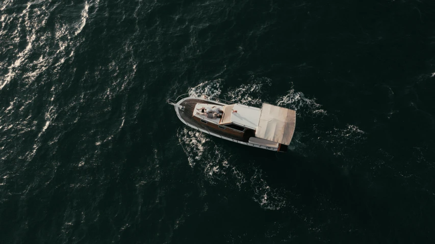 a small motor boat floating on top of water