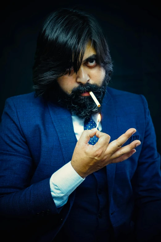 a man smoking a cigarette in a suit and tie