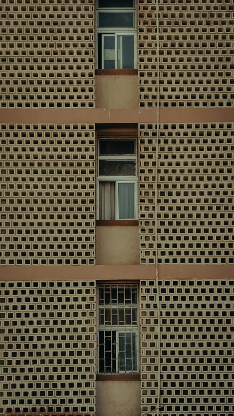 a window in a large building made of bricks