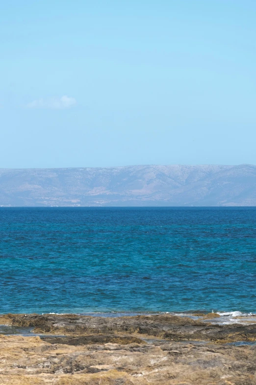 an open area with a lone beach chair on it