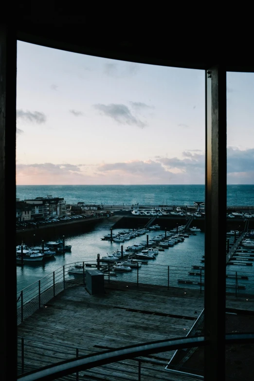 a view of a marina from inside of an elevator