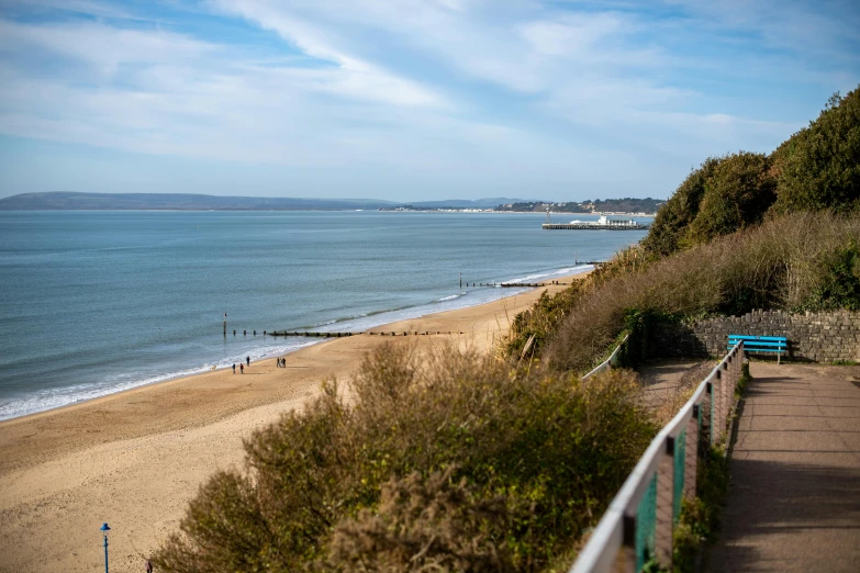 a view down a path to a beach