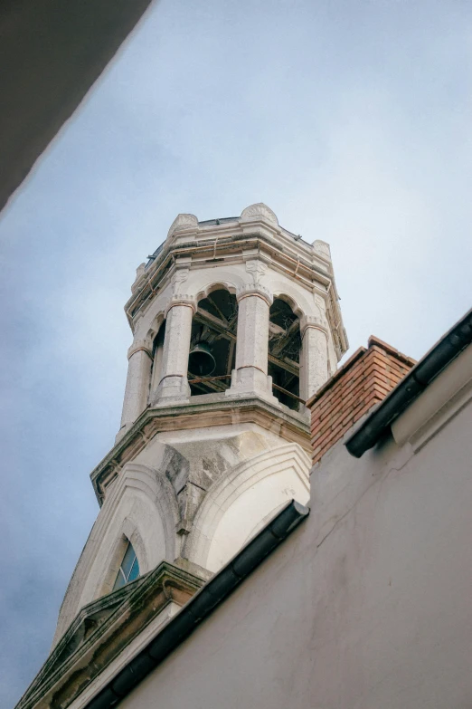 the tall building has a very fancy steeple