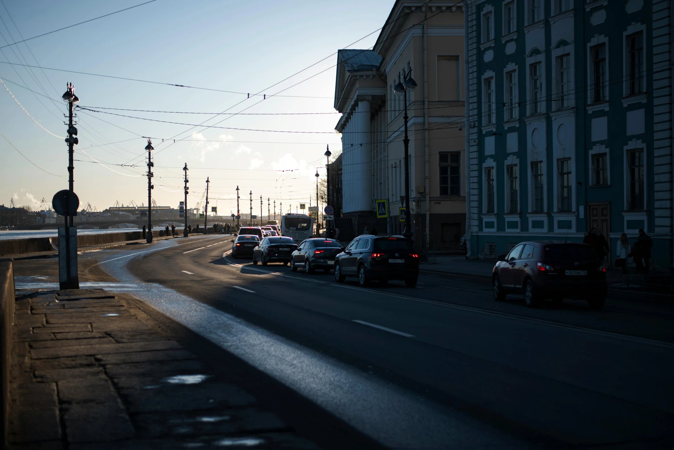 traffic on a street next to a water