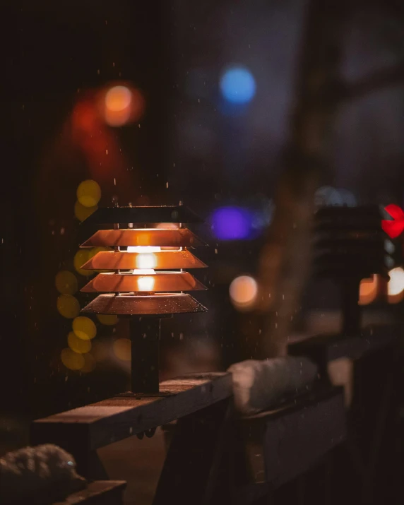 a small table lamp sitting on top of a wooden table