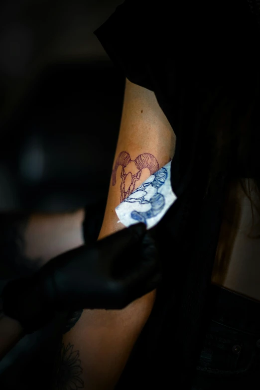 a woman holding a piece of paper with a elephant on it