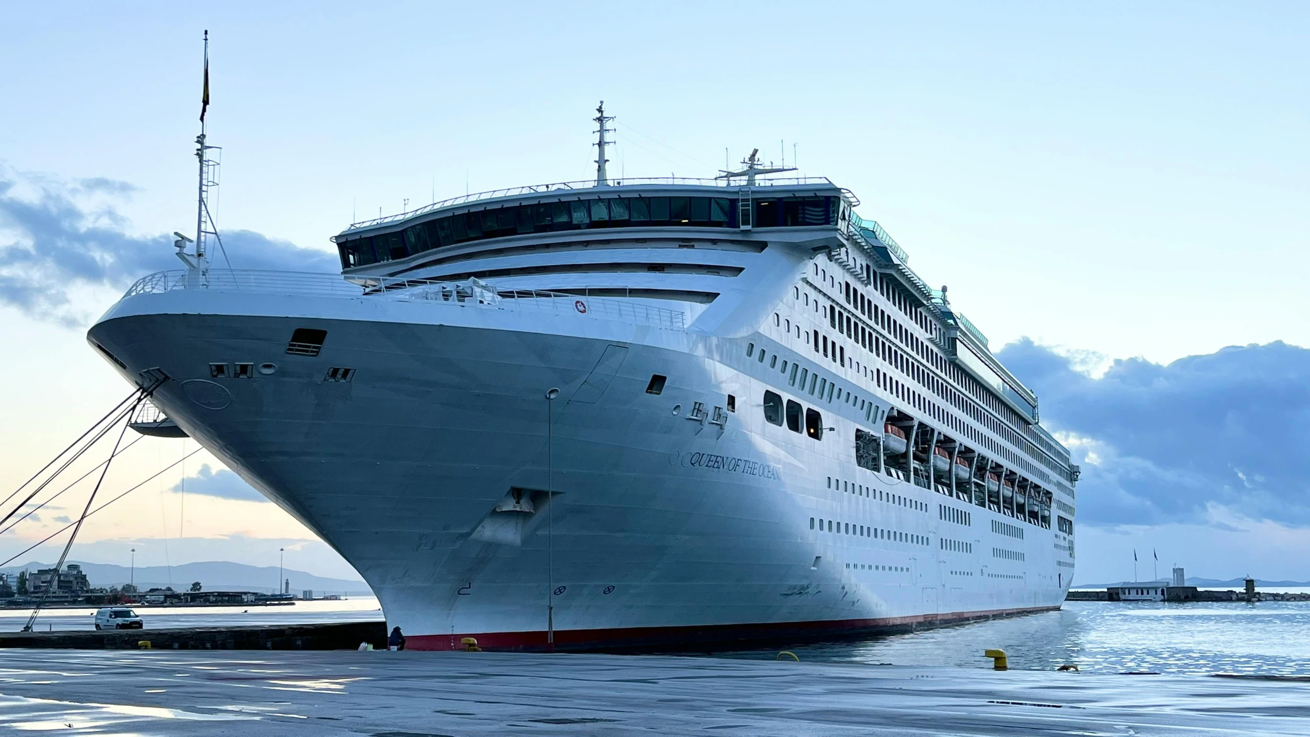 the large cruise ship is parked at the dock