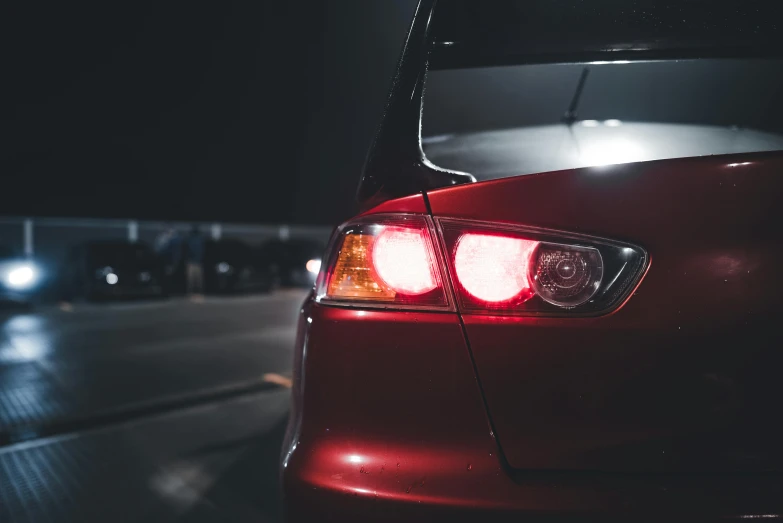 rear view of the front tail light of a car at night