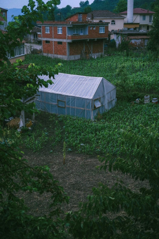 an old building sitting out in the middle of the woods