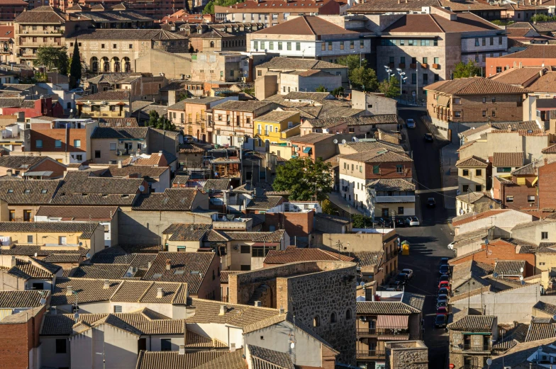 a city with brown roofs has many windows