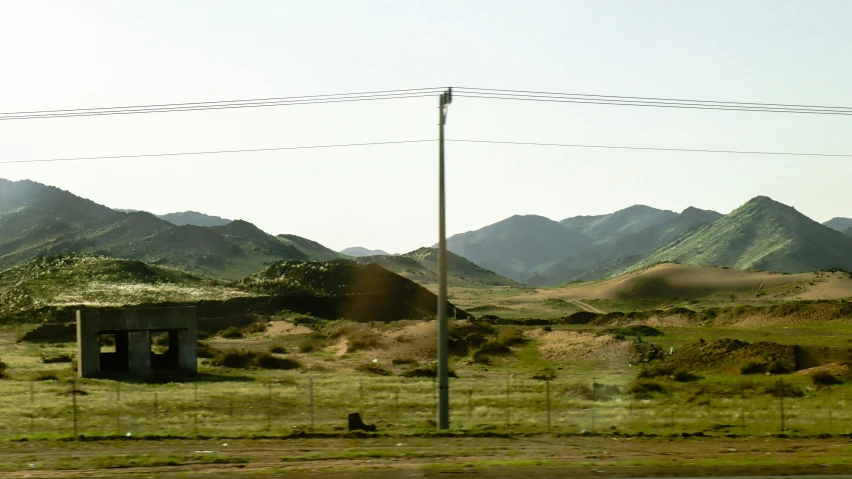 view of hills and a fence in the background