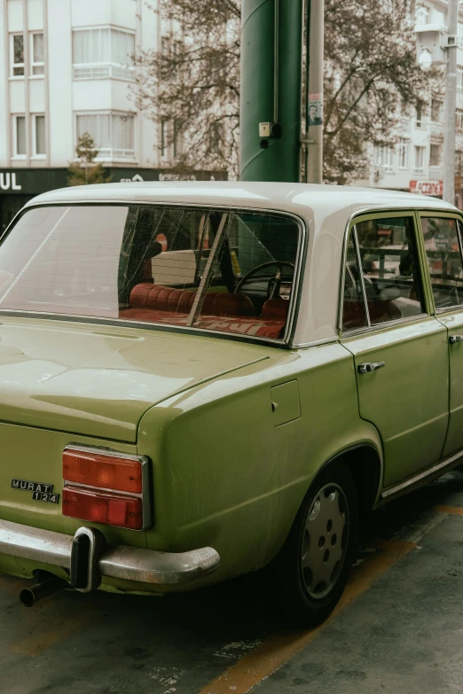 an old style car with a window full of some papers