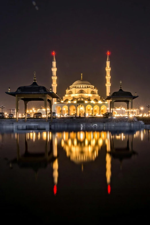 a large building is sitting over some water