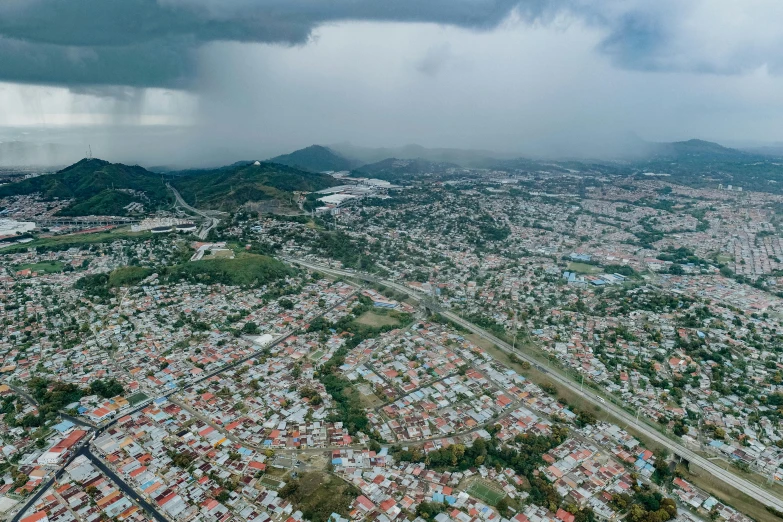 a aerial s of a city and the hills