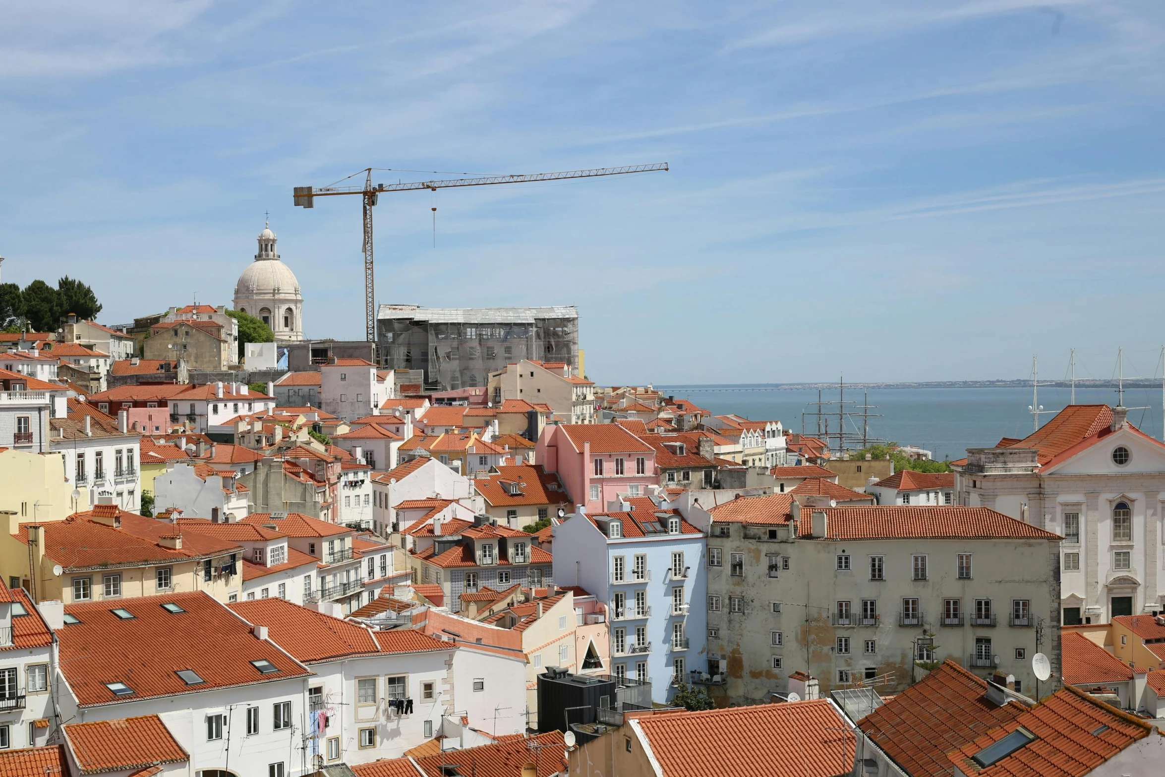 the rooftops and buildings are in an urban setting