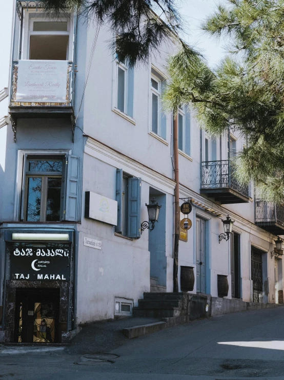 this is a very old fashioned building on a street corner