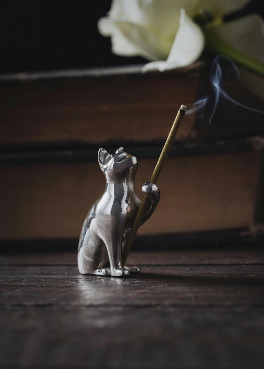 a toy koala smoking a cigarette on a table