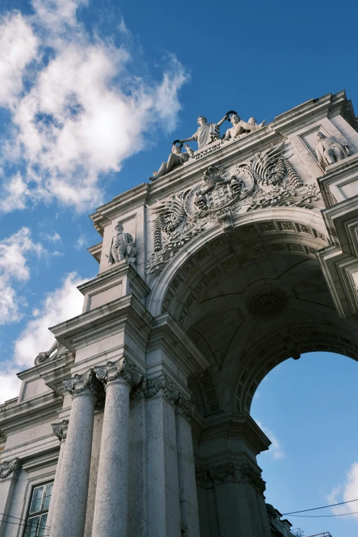 an archway built into the top of a building with an opening