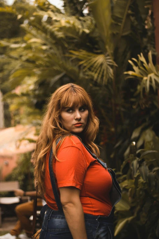 the woman is holding a hand bag with long hair