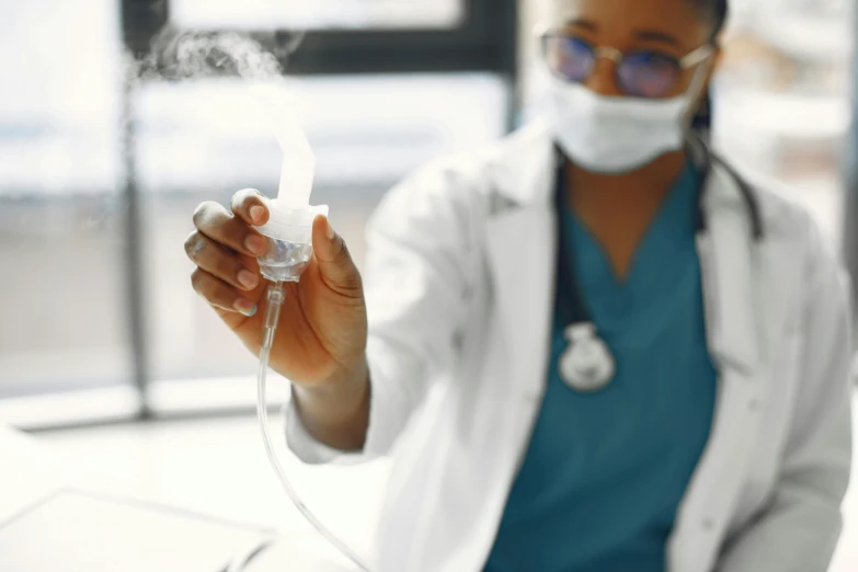 woman wearing medical gauze and holding a tube and lighter