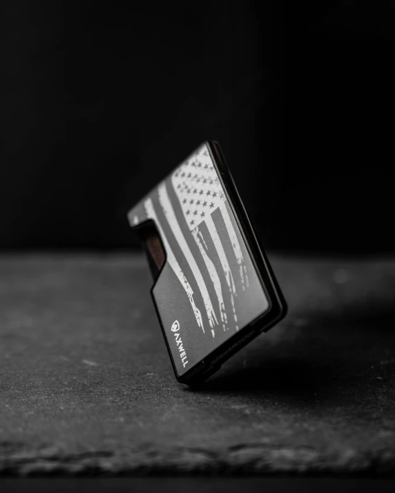 a black cardholder with an american flag pattern on it