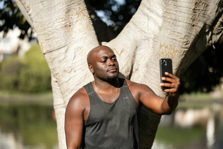 a man taking a picture with his phone