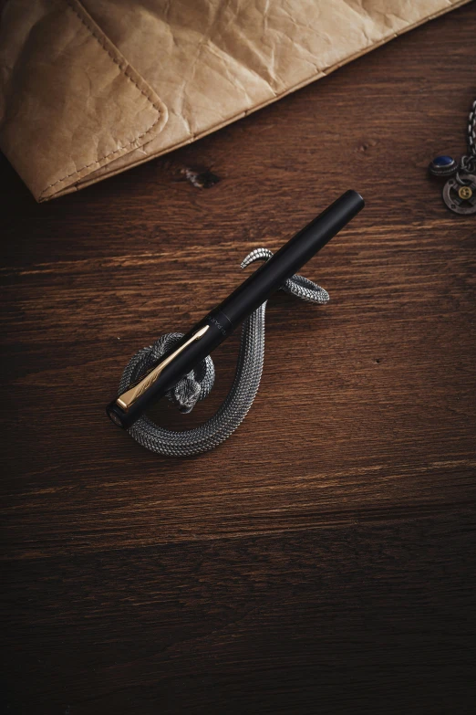 a pen sits on top of a wooden table