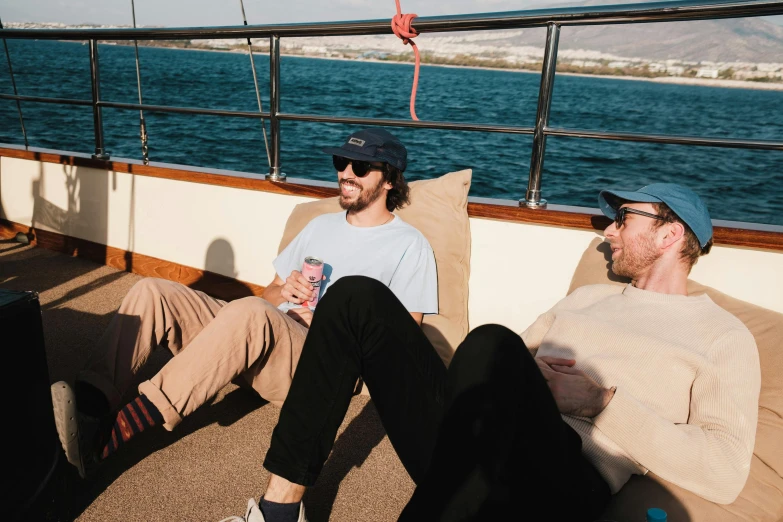 two men sitting in the middle of a boat