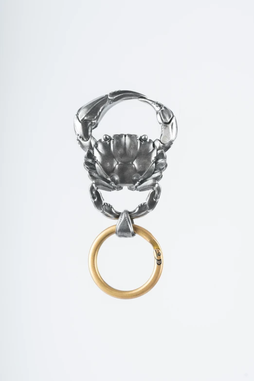 a ring with an open crab head on it
