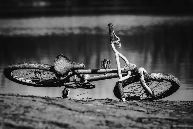 this is a bicycle parked near a lake