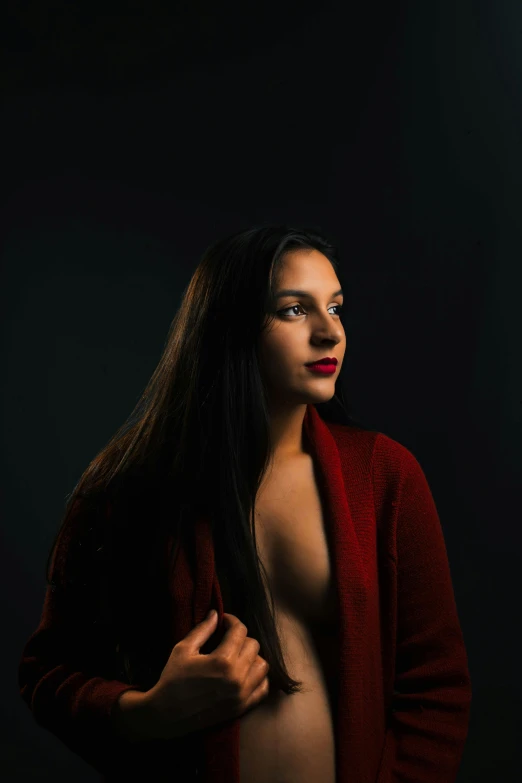 a  girl wearing a red sweater with long hair