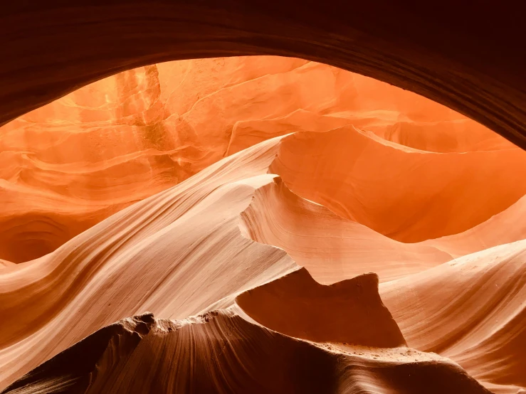 a view of a canyon from the inside of a cave