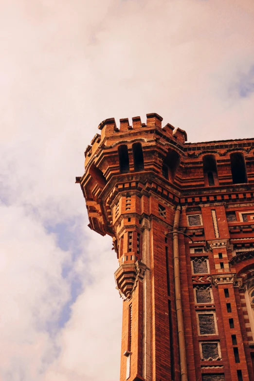 a tall building with a clock on each of it's sides