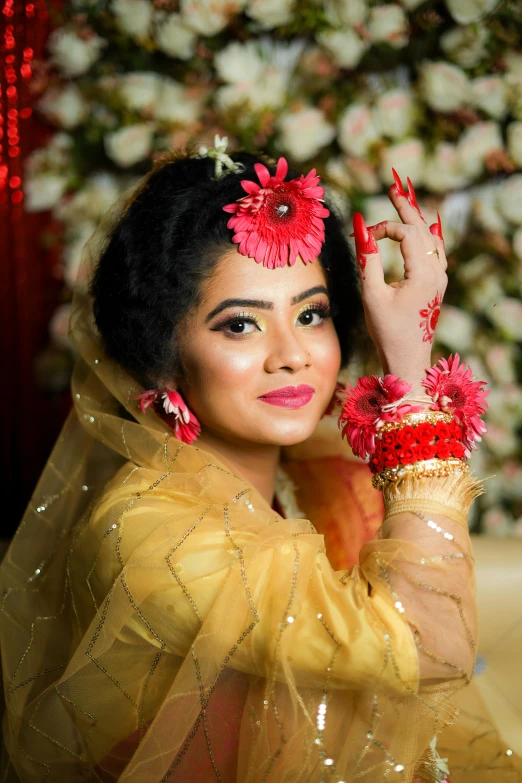 a woman wearing red flowers on her hair