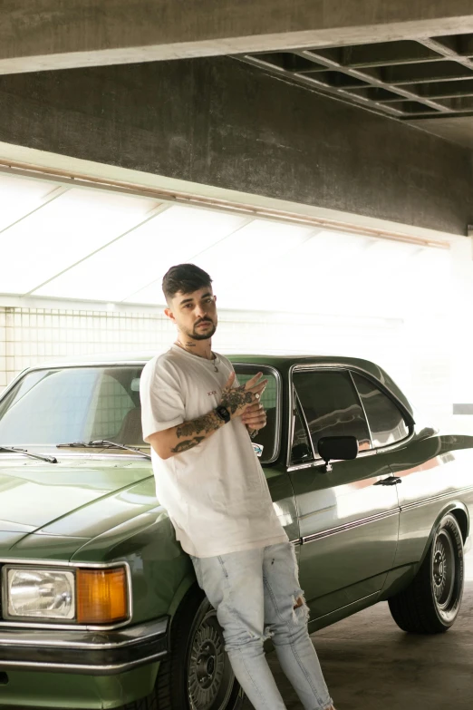 the man is standing next to a car