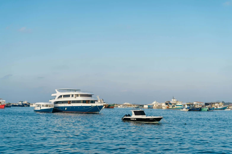 several boats in the water near shore