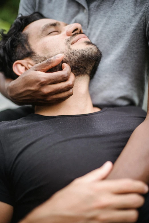 there is a man that is shaving his beard