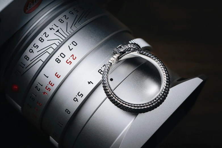 a silver ring rests on a lens that is being used