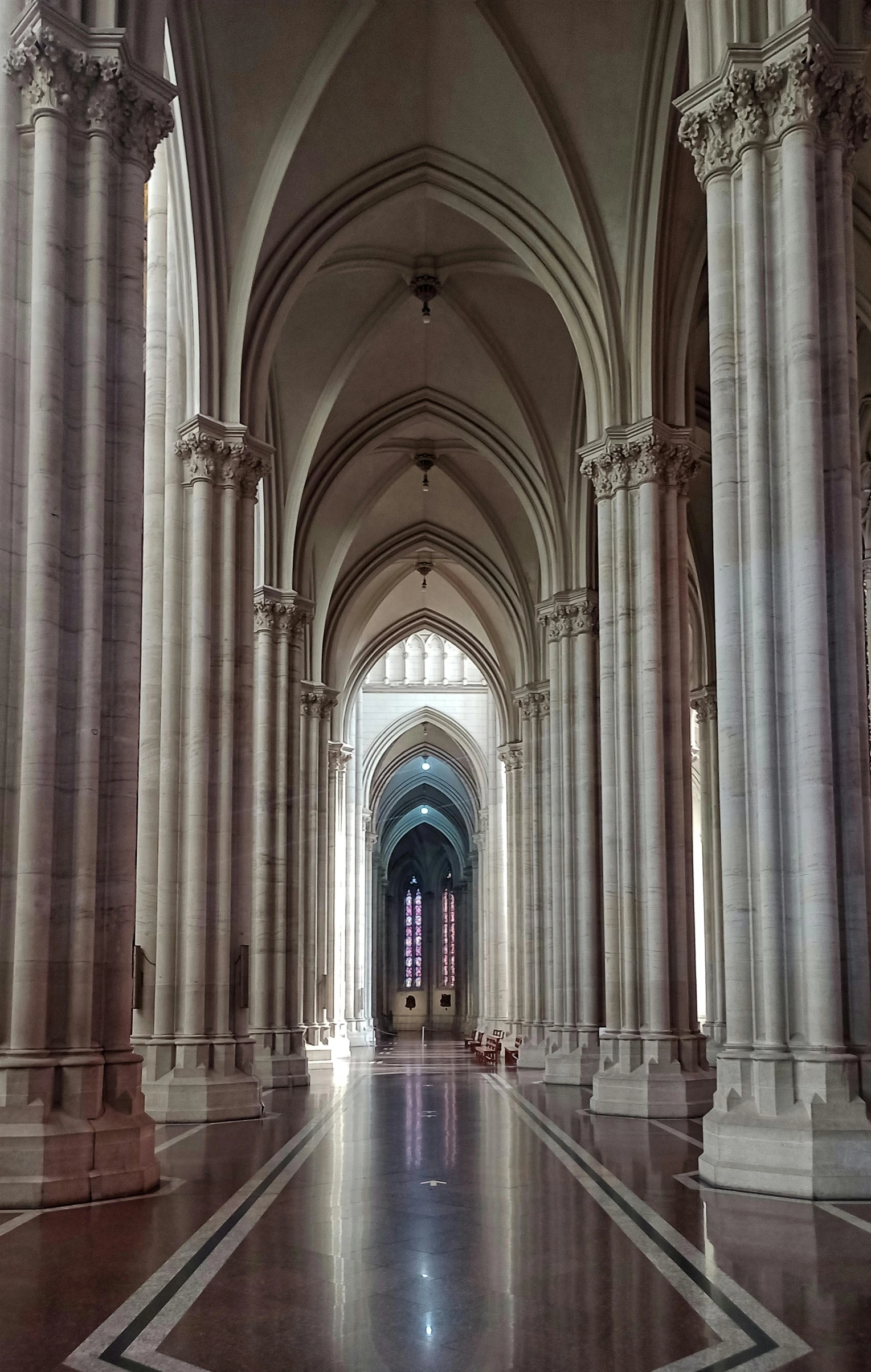 an empty cathedral that has columns and arches