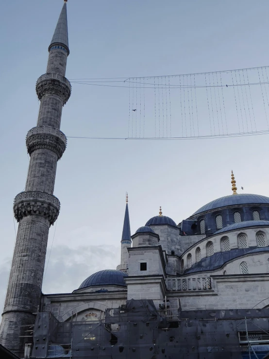 a building with a large blue dome and two spires