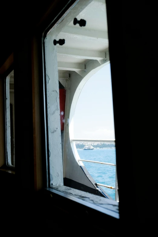 a large window with the sea seen from inside