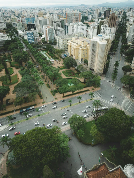 looking down at a busy parking lot and the city