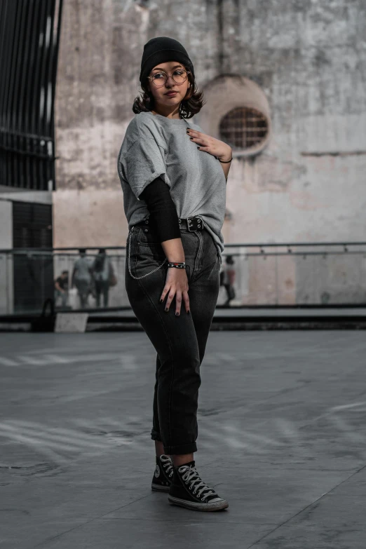 a woman standing in front of an old building posing for a po