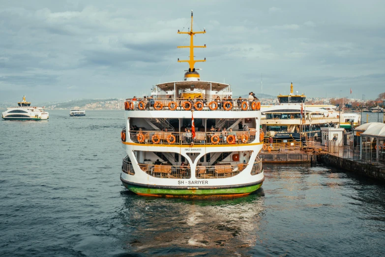 a large boat filled with people floating in the water