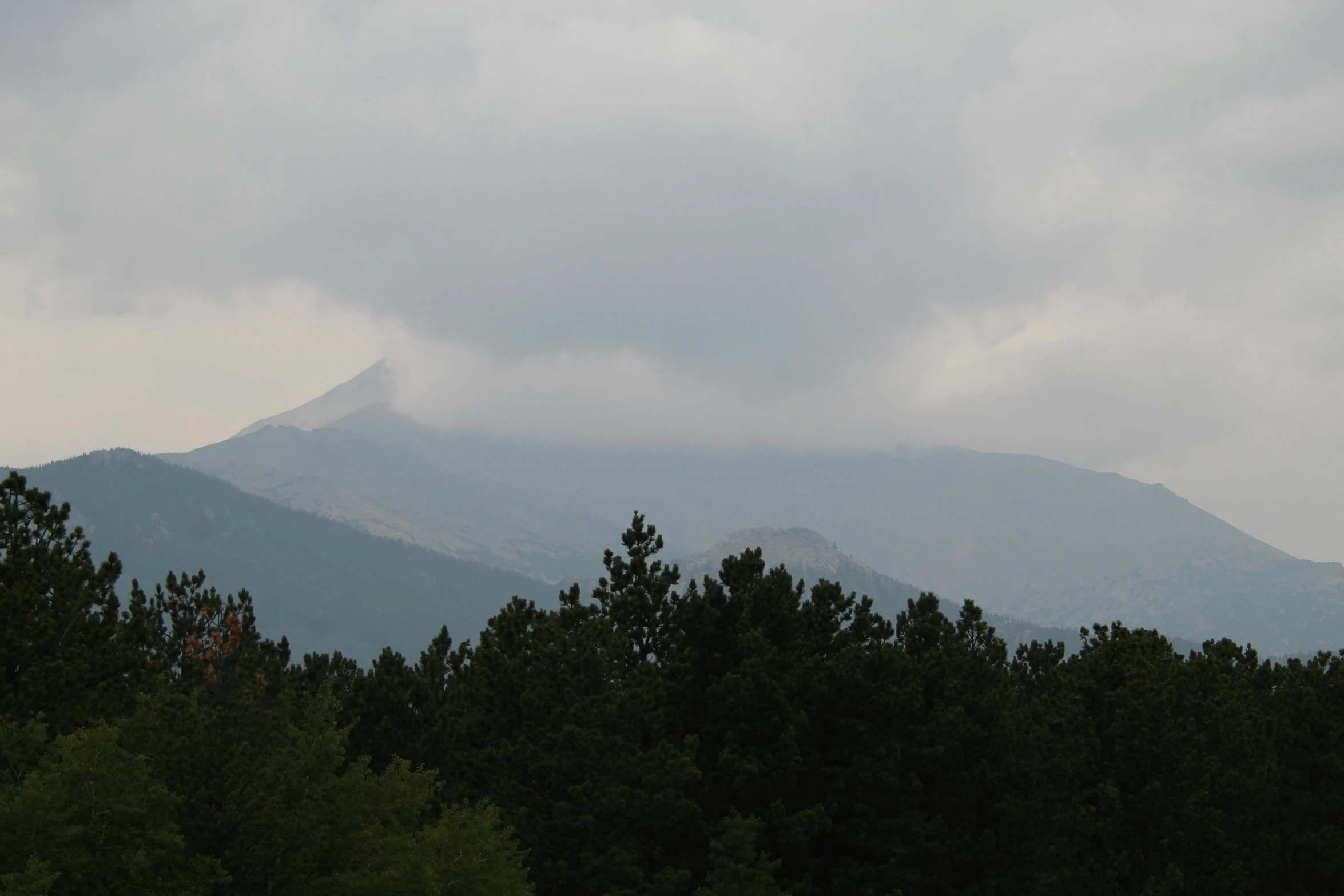 a scenic scene with mountains in the background