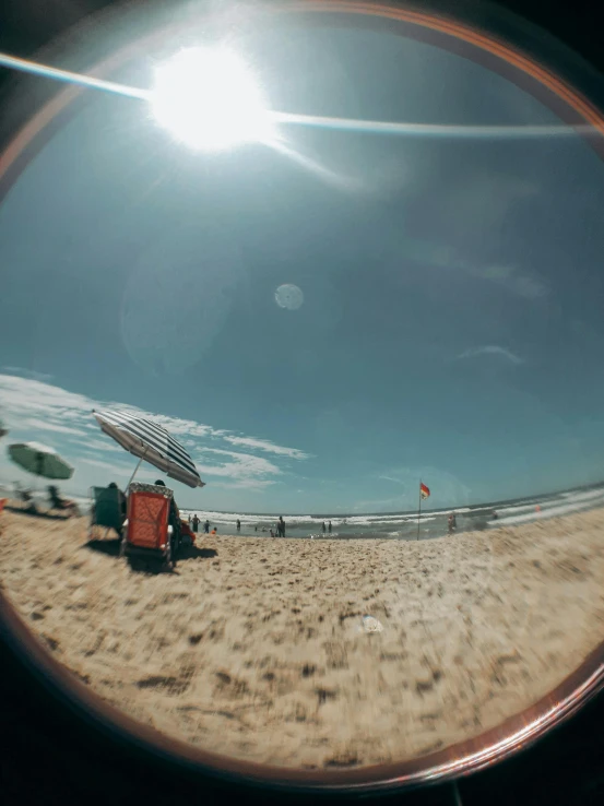 an airplane wing is reflecting on the beach